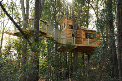 Inspiration for a large craftsman brown two-story wood exterior home remodel in Philadelphia with a shed roof