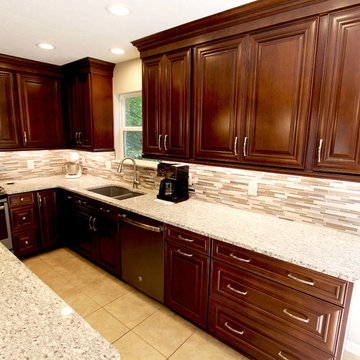 Waypoint Cherry Chocolate Cabinets and Giallo Ornamental Granite Countertops
