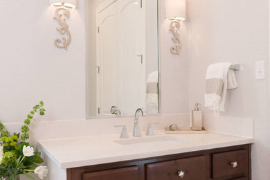 Bathroom - mid-sized transitional master white tile and porcelain tile travertine floor bathroom idea in Austin with an undermount sink, dark wood cabinets, quartz countertops and gray walls