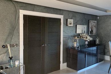 This is an example of a medium sized modern enclosed living room in Other with grey walls.