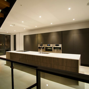 Contemporary Photo-Led Kitchen with Floating Wood Stair and Custom Cabinetry