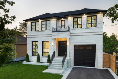 Inspiration for a mid-sized transitional multicolored two-story concrete house exterior remodel in Toronto with a hip roof and a shingle roof