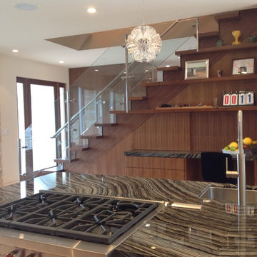 Nerve center concealed under steel and walnut stairway