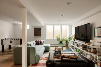Family room - mid-century modern family room idea in Denver
