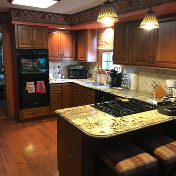 cabinet refacing--cherry cabinets with black glazing