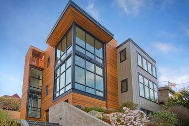 Trendy wood exterior home photo in Seattle