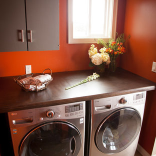 Photo of a traditional utility room in Los Angeles with brown cabinets, beige floors and brown worktops.