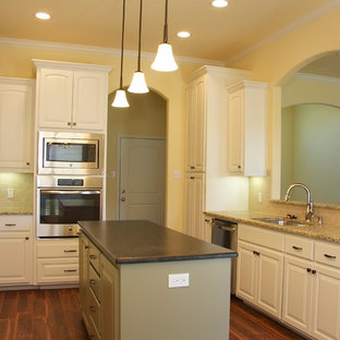 White Cabinets with Raised Panel Doors , Custom Vent Hood and Island