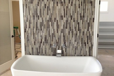 Bathroom - contemporary glass tile bathroom idea in Detroit