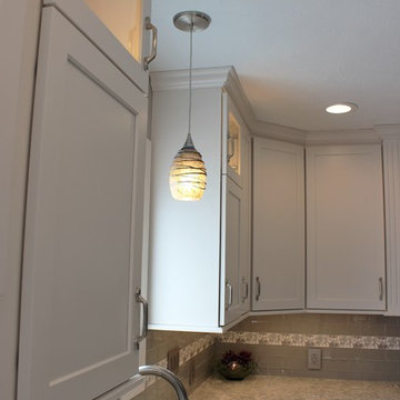 Alpha, IL White and Gray Kitchen with Hidden Laundry and Raised Dishwasher