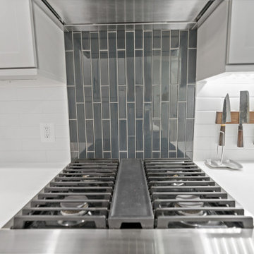 Stylish Kitchen with Magnetic Knife Holder and Tile Backsplash