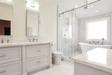 Example of a mid-sized master white tile double-sink bathroom design in Orange County with white cabinets, a one-piece toilet, white walls, white countertops, a built-in vanity and quartz countertops