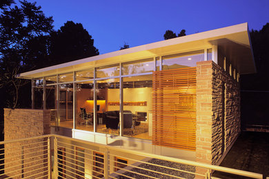 Trendy stone exterior home photo in Denver