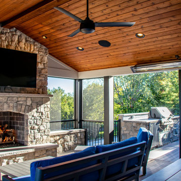 Outdoor Room with a Double Fireplace Feature