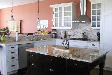 Inspiration for a large transitional l-shaped dark wood floor eat-in kitchen remodel in Toronto with a double-bowl sink, shaker cabinets, white cabinets, granite countertops, white backsplash, matchstick tile backsplash, stainless steel appliances and an island
