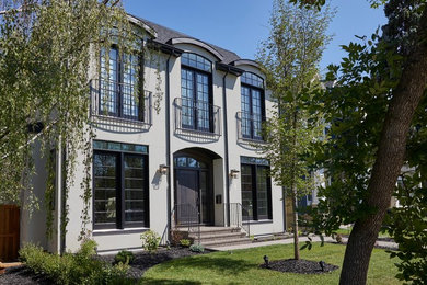 Example of a transitional exterior home design in Calgary