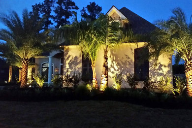 Inspiration for a mid-sized mediterranean front yard landscaping in New Orleans.