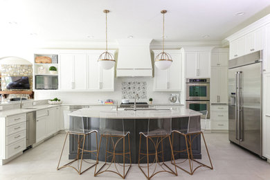 Open concept kitchen - large transitional u-shaped ceramic tile and white floor open concept kitchen idea in Other with an undermount sink, recessed-panel cabinets, white cabinets, quartzite countertops, white backsplash, ceramic backsplash, stainless steel appliances, an island and white countertops