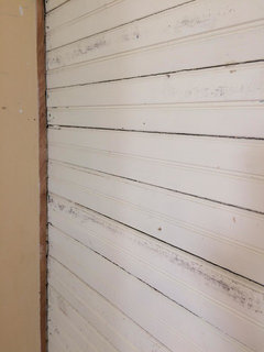 Original 1930s walls uncovered in kitchen-- bead board and 24 studs!