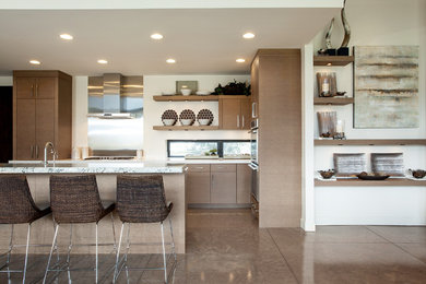Mid-sized trendy concrete floor eat-in kitchen photo in Salt Lake City with flat-panel cabinets, beige cabinets, an island, an undermount sink, quartzite countertops, white backsplash and stainless steel appliances