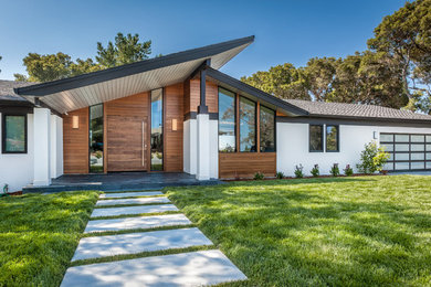 Large 1950s white one-story mixed siding exterior home photo in San Francisco
