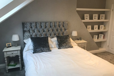Photo of a mid-sized contemporary master bedroom in Essex with white walls, carpet and grey floor.