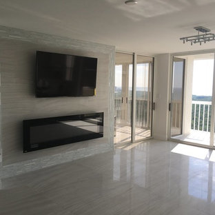 Inspiration for a mid-sized modern open concept porcelain tile living room remodel in Miami with beige walls, a ribbon fireplace, a tile fireplace and a wall-mounted tv