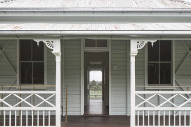 Photo of a large front door in Other with medium hardwood floors.