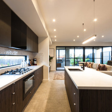Contemporary kitchen with letterbox window and sliding doors