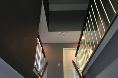 Inspiration for a mid-sized timeless straight wood railing staircase remodel in Los Angeles