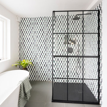 Fresh contemporary bathroom with freestanding bath and walk in shower
