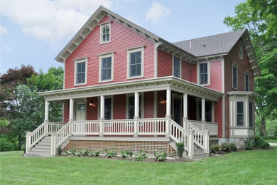 Mid-sized traditional red two-story exterior home idea in Providence