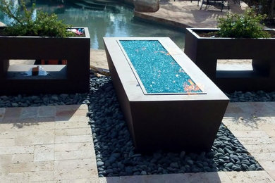 Inspiration for a contemporary landscaping in Phoenix with a fire pit.