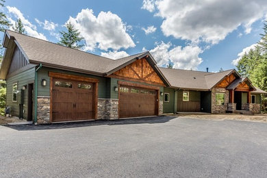 Mid-sized craftsman multicolored two-story mixed siding house exterior idea in Seattle with a hip roof and a shingle roof