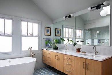 Inspiration for a contemporary master double-sink freestanding bathtub remodel in Portland