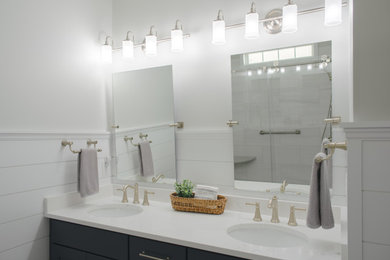 Example of a mid-sized master beige tile and ceramic tile ceramic tile, blue floor, double-sink and shiplap wall bathroom design in Other with shaker cabinets, blue cabinets, a one-piece toilet, beige walls, an undermount sink, quartzite countertops, white countertops and a built-in vanity