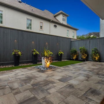 Modern River Oaks Patio with Urn Focal Point