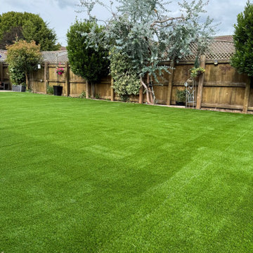 Wide Artificial Lawn Between Boundary Fences