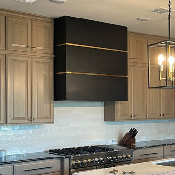Sleek Stainless Steel Range Hood for a Refined Contemporary Kitchen