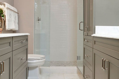 This is an example of a mid-sized traditional master bathroom in Raleigh with shaker cabinets, grey cabinets, quartzite benchtops, an open shower, white tile, subway tile, marble floors, grey walls and an undermount sink.