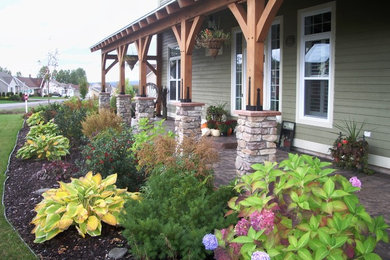 Inspiration for a craftsman porch remodel in Orange County with a roof extension