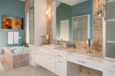 Bathroom - large contemporary master black and white tile and stone slab marble floor bathroom idea in Dallas with a drop-in sink, flat-panel cabinets, white cabinets, marble countertops, a two-piece toilet and blue walls
