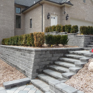 Tiered Unilock Pisa Retaining Walls with a Staircase & Paver Landings