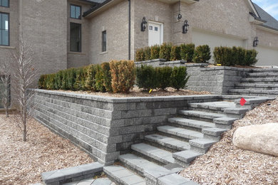 Tiered Unilock Pisa Retaining Walls with a Staircase & Paver Landings