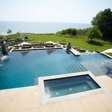 Modern pool, spa and landscape on lakeshore