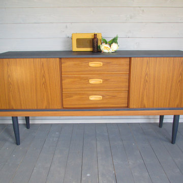 A fake-wood effect sideboard that got brightened up a bit in blue and mustard.