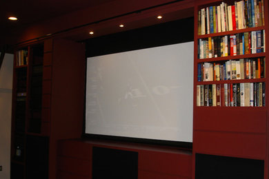 Living room - living room idea in Phoenix with red walls