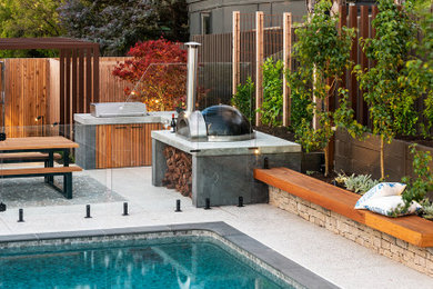 This is an example of a large contemporary backyard garden in Melbourne.