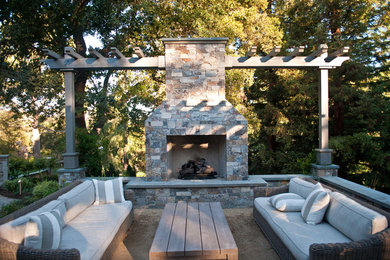 Inspiration for a traditional backyard patio in San Francisco with a fire feature and no cover.