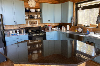 Example of a mountain style kitchen design in Denver